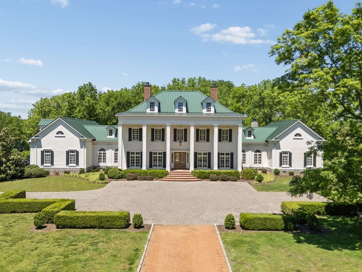 grand estate facade and formal approach